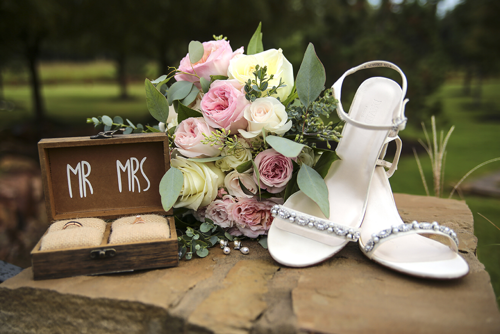 Mr. and Mrs. wedding ring box, bridal bouquet and wedding shoes