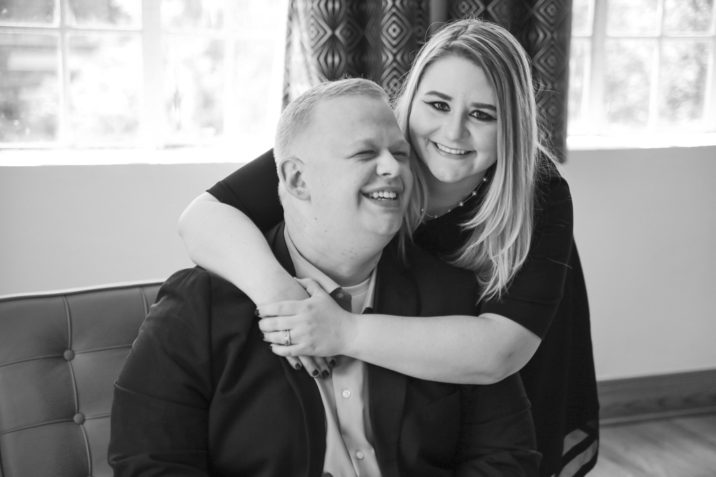 Laughing couple engagement photo in black and white