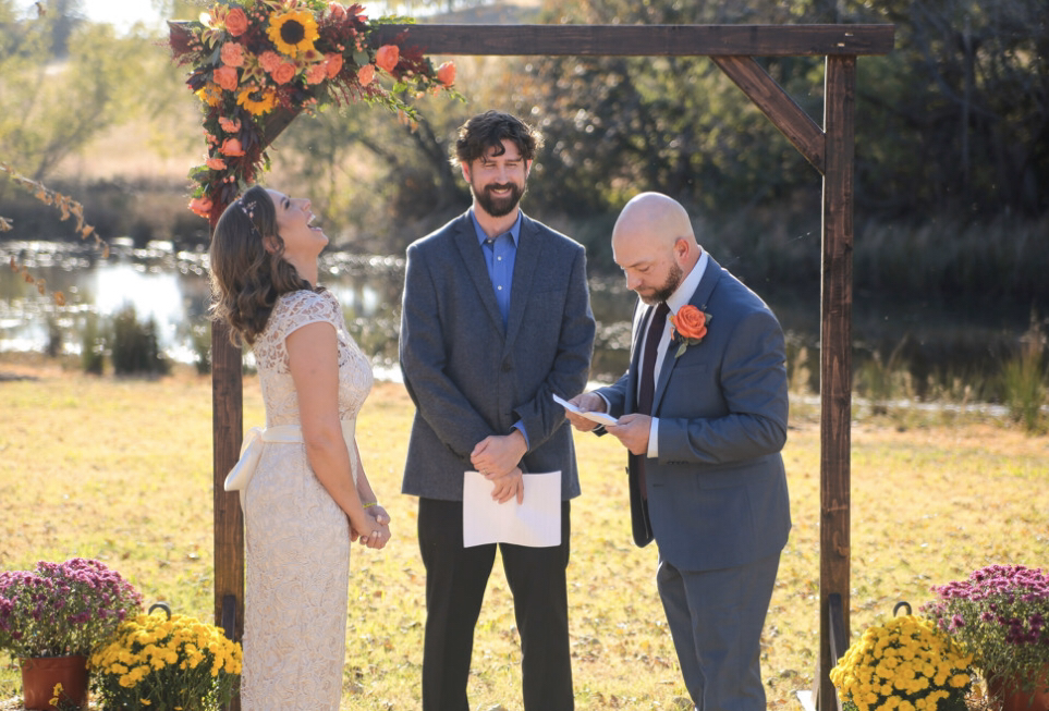 Bride and groom reading wedding vows in Oklahoma City. Photo by affordable wedding photographer, Kenzie’s Photography